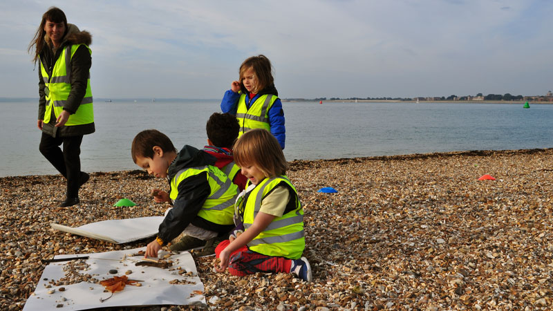 Pre school students at PGS learning through play at the beach