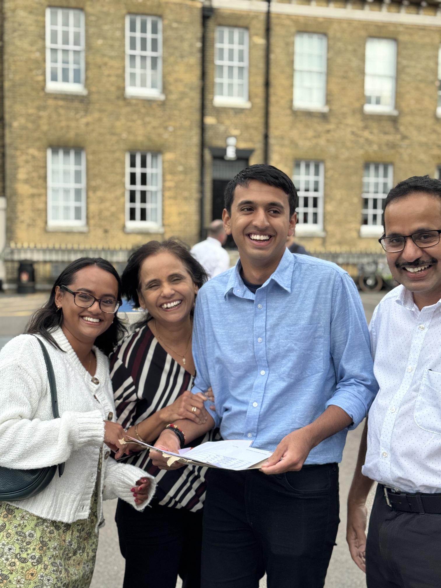 Bhushan celebrating A Level results with his family